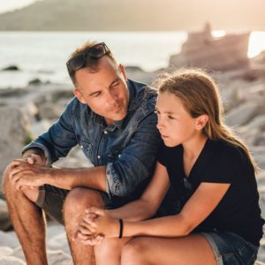 father and daughter at the beach